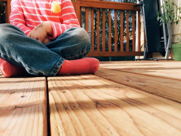 Boy Sitting on Decking | eDecks